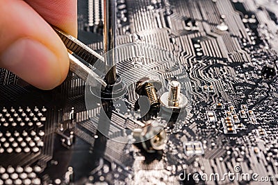 Computer repair, installation motherboard with screws