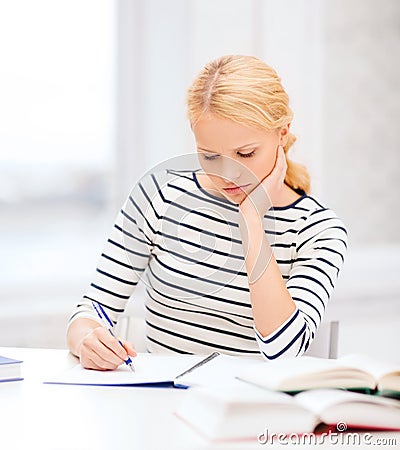 Concentrated woman studying in college