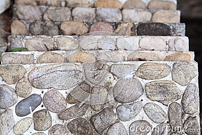 Concrete construction block with stones decoration