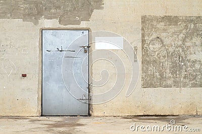 Concrete wall with metal door