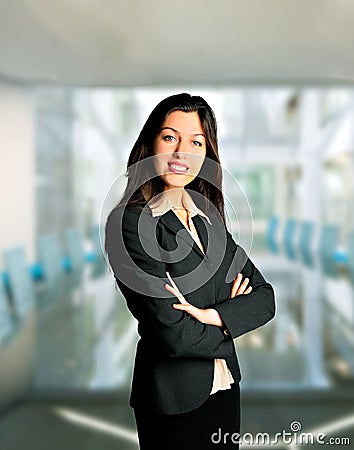 Confident business woman with folded arms