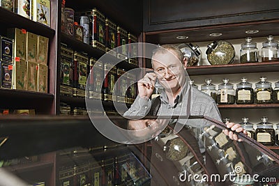 Confident Male Owner In Tea Shop