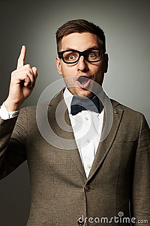 Confident nerd in eyeglasses and bow tie