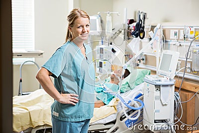 Confident Nurse With Patient Resting In Hospital