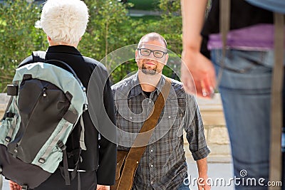 Confident Student Walking On College Campus