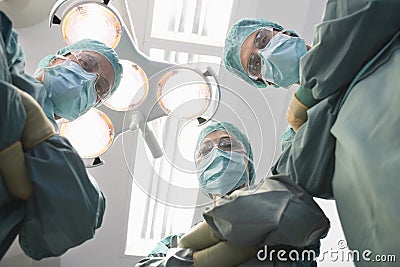 Confident Surgeons In Operating Theatre