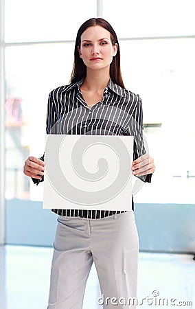 Confident woman showing a big business card