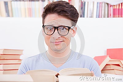 Confused student surrounded by books
