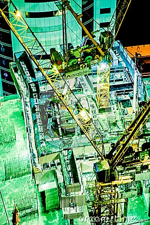 Construction Dubai night cranes