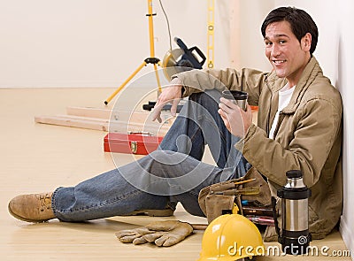 Construction worker taking a coffee break
