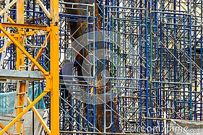 A Construction Worker welding steel bars.