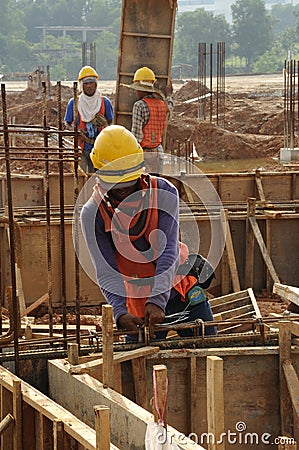 A construction Workers Fabricating Reinforcement Bar