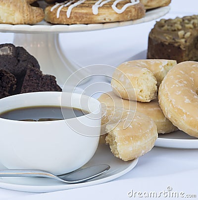Continental breakfast buffet table setting with coffee and pastr