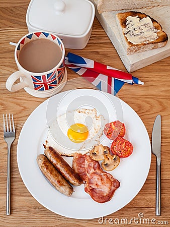 Cooked english breakfast on a wooden table