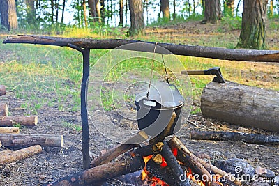 Cooking fish soup on the fire