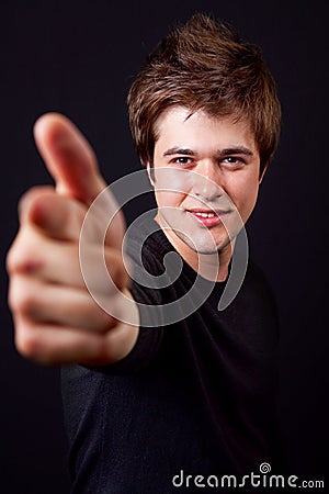 Cool handsome trendy man pointing at you