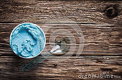 Cool refreshing blue Italian ice cream in a tub