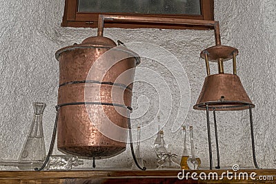 Copper still alembic inside distillery