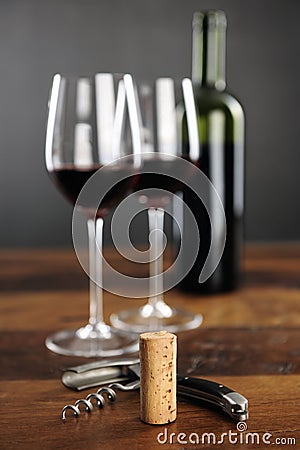Cork, corkscrew and red wine