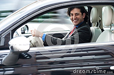 Corporate man driving his car