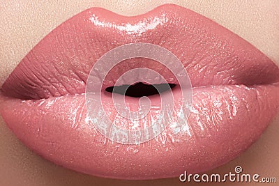 Cosmetics, gloss make-up. Macro fashion lips kiss
