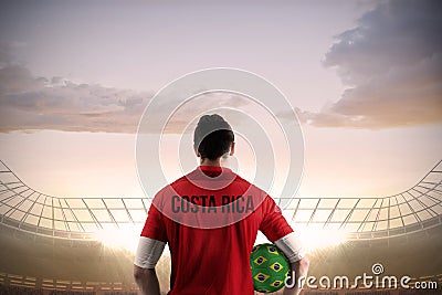 Costa rica football player holding ball