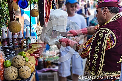 Costumed vendors sell ice cream