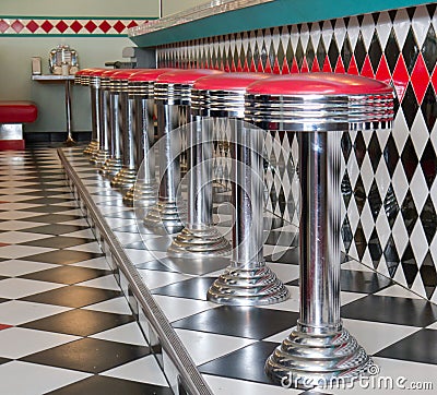 Counter Stools in a row at a 50 s style diner
