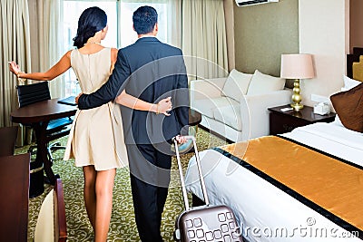 Couple arriving to hotel room