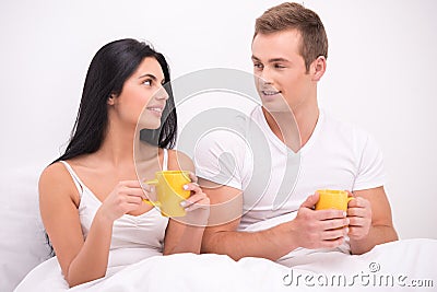 http://thumbs.dreamstime.com/x/couple-bed-drinking-tea-coffee-young-sitting-under-white-blanket-early-morning-having-their-breakfast-man-women-50287660.jpg