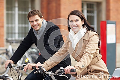 Couple on bicycles in city