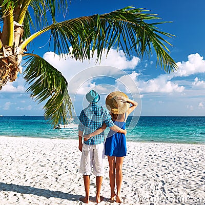 Couple in blue clothes on a beach at Maldives