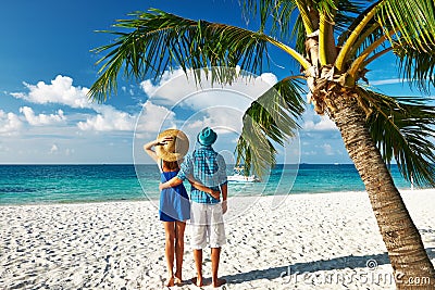 Couple in blue clothes on a beach at Maldives