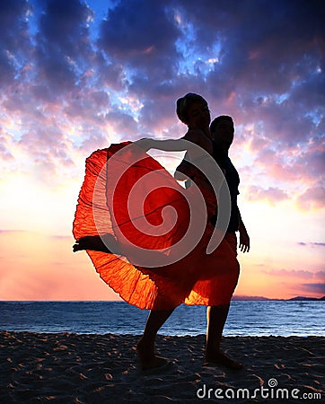 Couple dancing at sunset