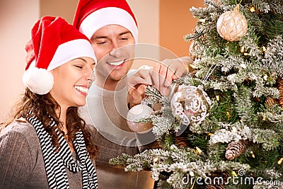 Couple Decorating Christmas Tree