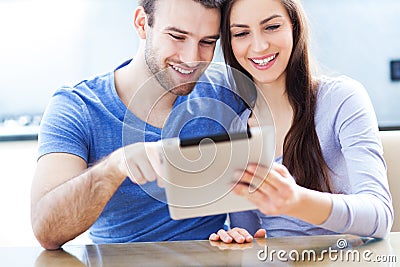 Couple with digital tablet