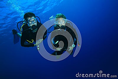 Couple diving on coral reef