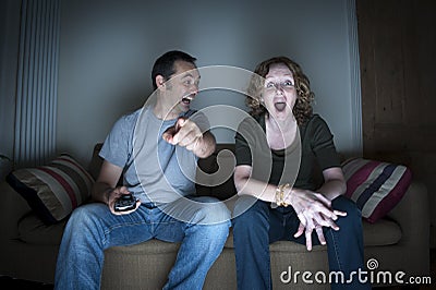 Couple enjoying watching television together