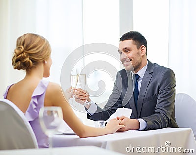Couple with glasses of champagne at restaurant