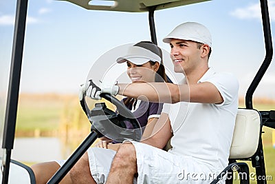 Couple in golf car