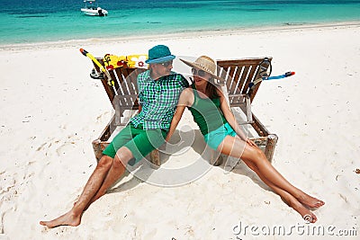 Couple in green on a beach at Maldives