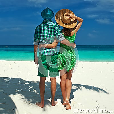 Couple in green on a beach at Maldives
