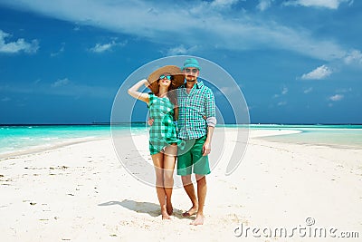 Couple in green on a beach at Maldives