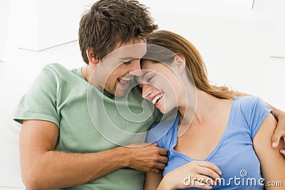 Couple in living room smiling