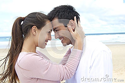 Couple in love on the beach flirting