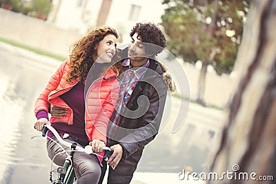 Couple in love riding a bicycle together