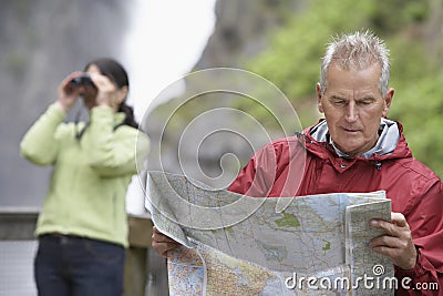 Couple With Map And Binoculars