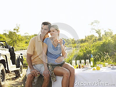 Couple On Picnic During Safari By Jeep