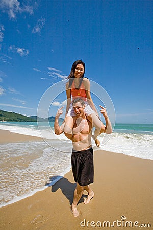 Couple playful by the beach