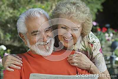 Couple Reading Newspaper Together